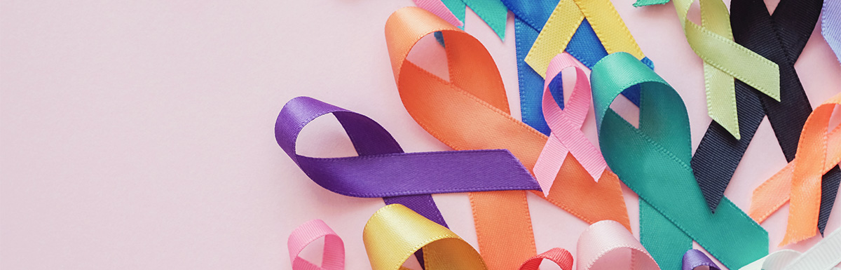 colorful ribbons on pink background for cancer awareness