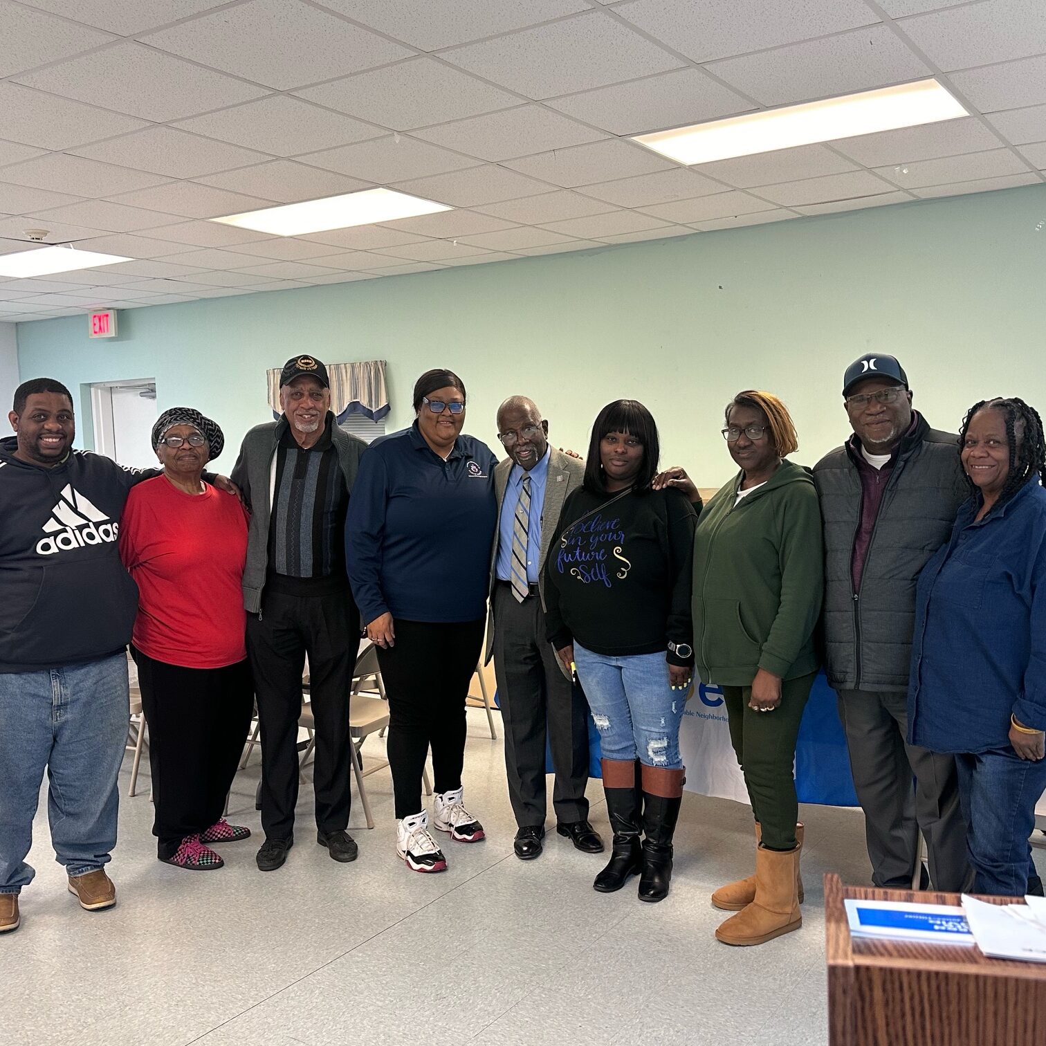 Midway residents pose with Reverend Jones after the workshop